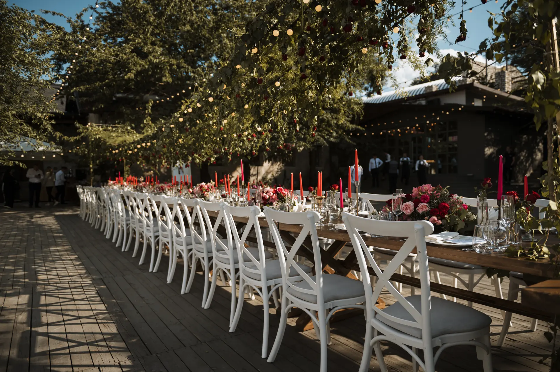 Outdoor wedding table arrangement with floral styling and ambient decor